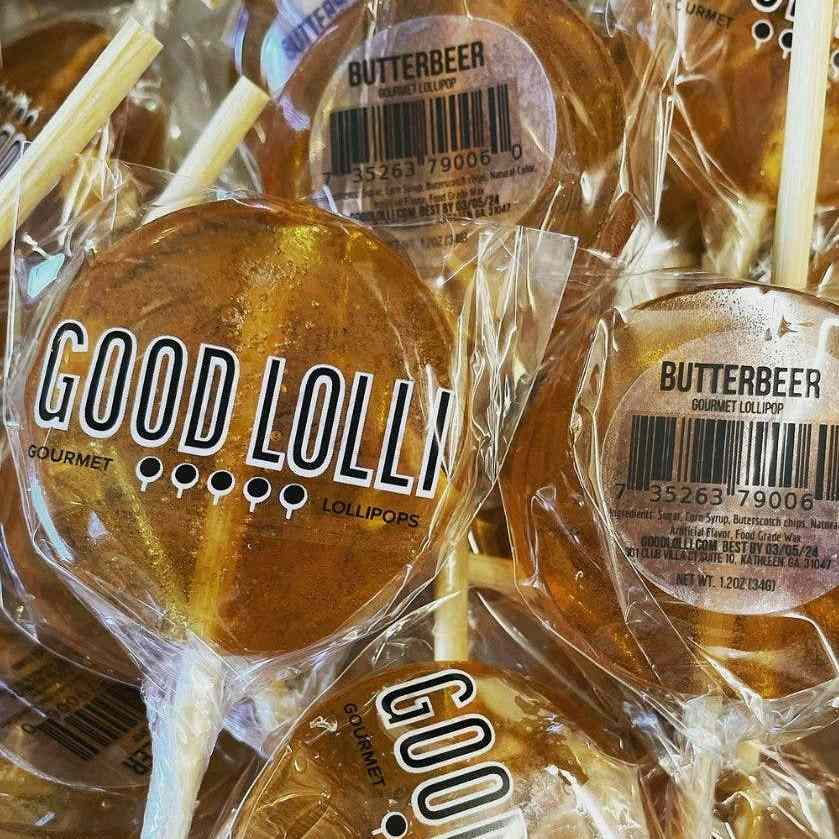 Good Lolli | Butterbeer LOLLIPOP | A pile of butterbeer lollipops wrapped in a cellophane wrapper.