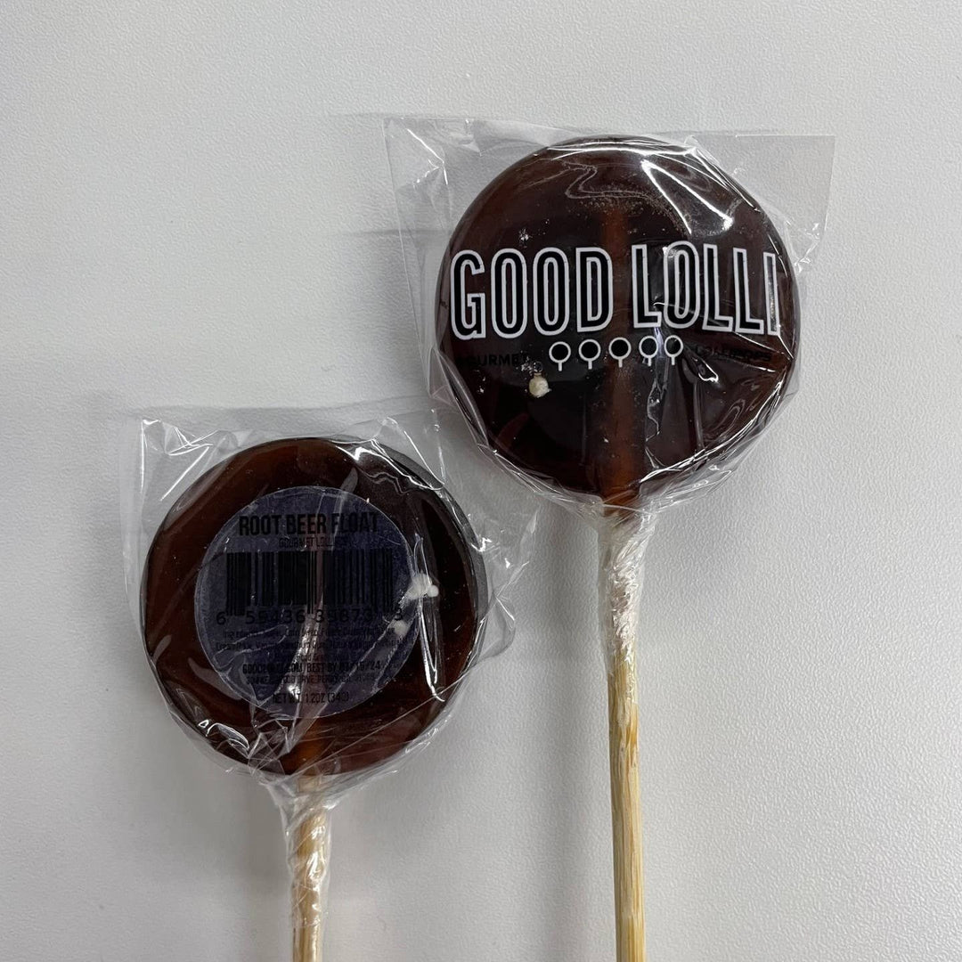 Good Lolli | Root Beer Float Lollipop | A dark brown lollipop in clear packaging.