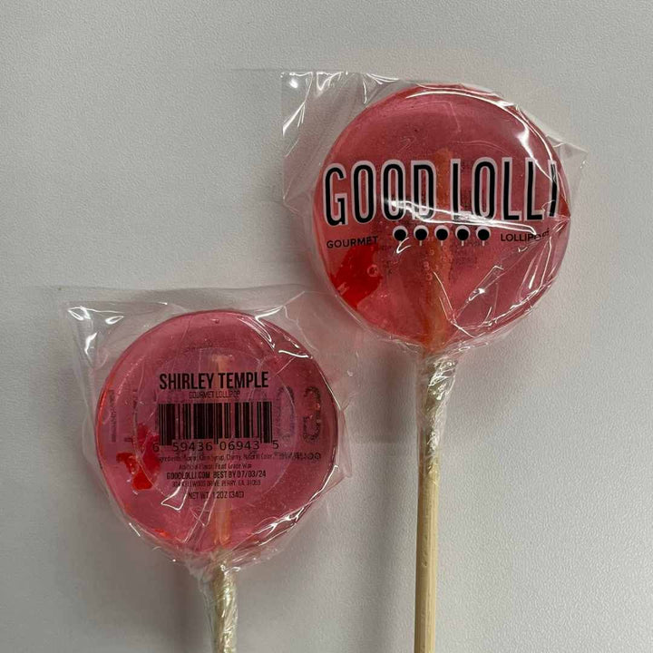 Good Lolli | SHIRLEY TEMPLE LOLLIPOP  | A light pink transparent lolli pop wrapped in clear cello.