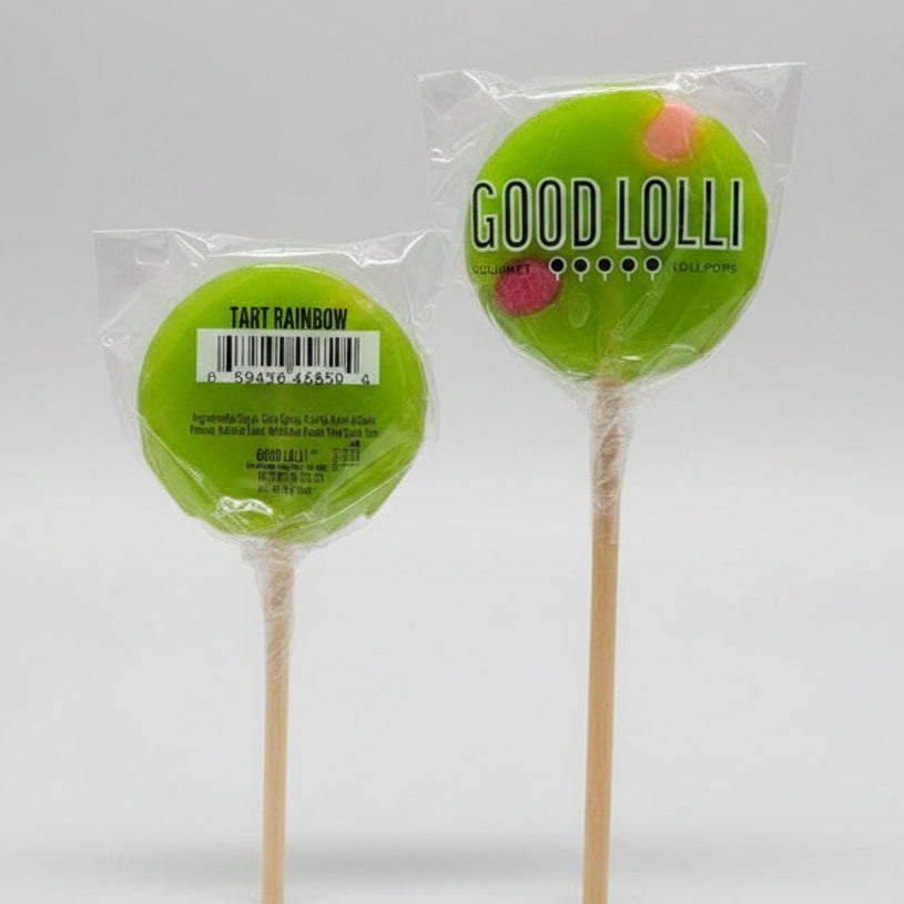 Two green lollipops on sticks with 'Good Lolli' packaging on a dark surface.
