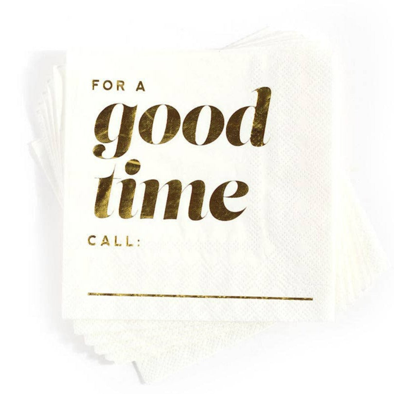 A white paper napkin with gold foiled text that reads "for a good time call:_____".