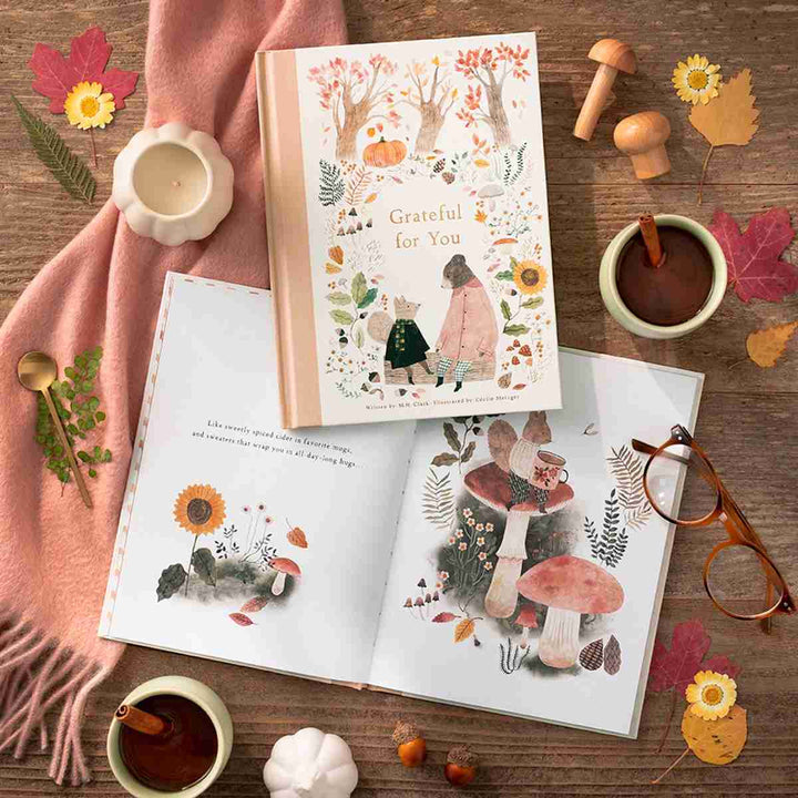 Compendium | Grateful For You | Book on a table with fall nature themed items and an open book spread.