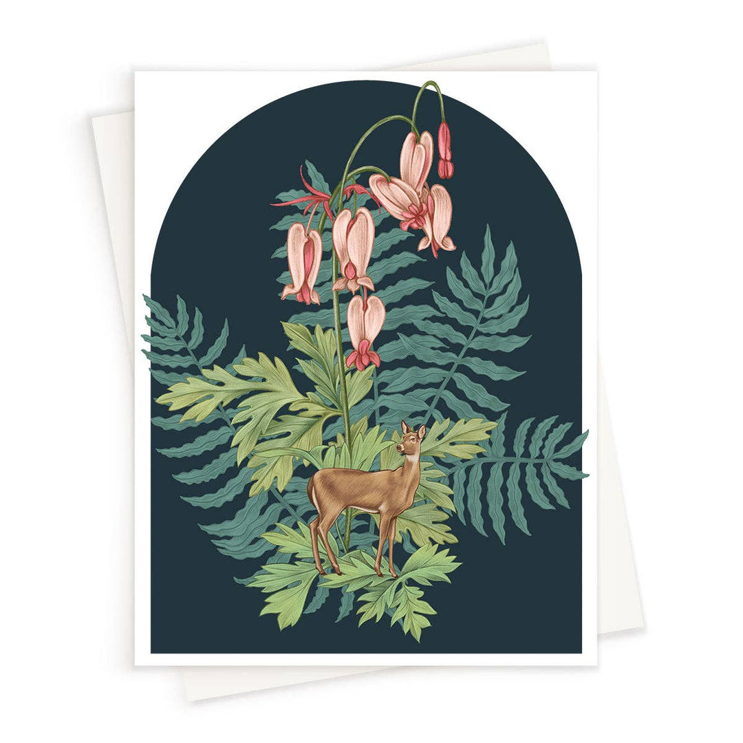 Card with a deer and floral design on a dark blue background