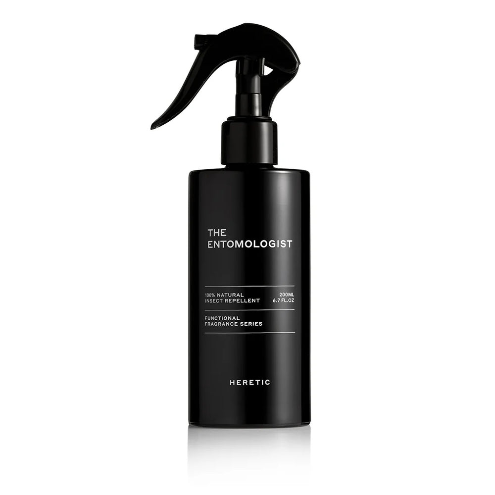 Heretic Beauty | The Entomologist | 100% natural insect repellent. A black spray bottle with simple text. 200mL, 6.7oz. A part of their functional fragrance series.