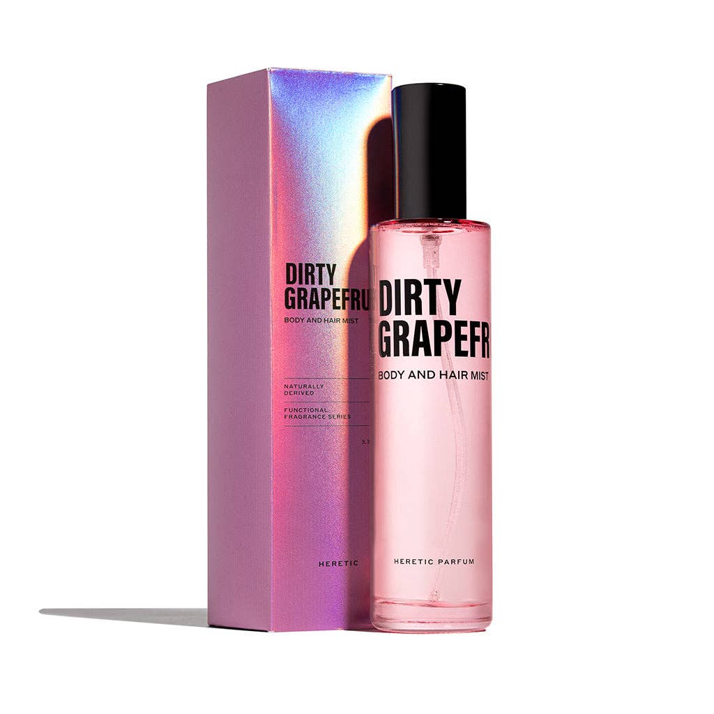 Heretic Parfum | Pink 'Dirty Grapefruit' body and hair mist with packaging on a white background