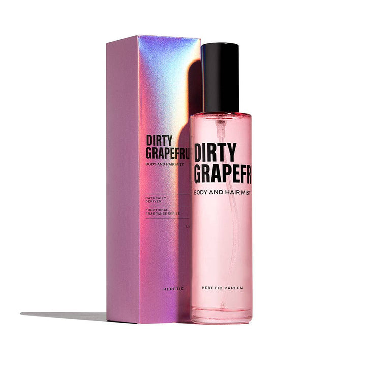 Heretic Parfum | Pink 'Dirty Grapefruit' body and hair mist with packaging on a white background
