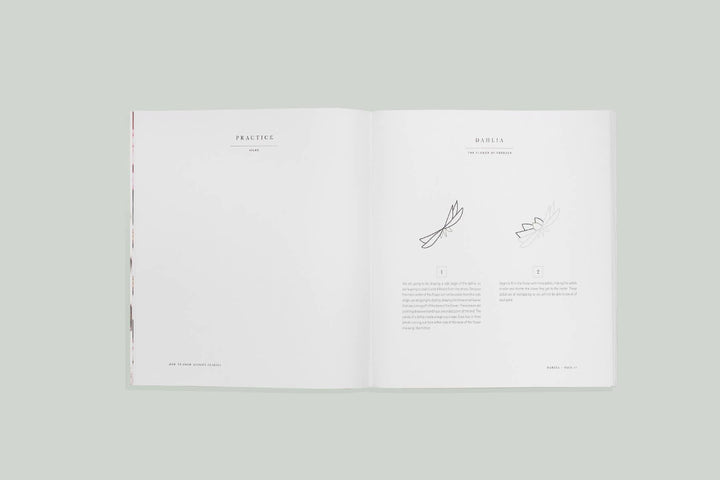 Open book with text and minimal design on a light gray background