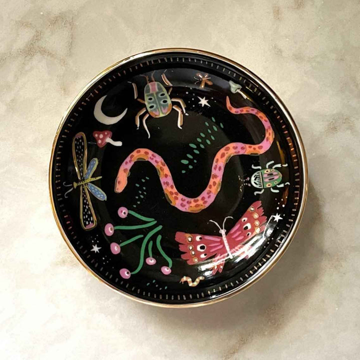 Idlewild Co. | Midnight Garden Trinket Dish | A black dish with colorful bugs and accents.