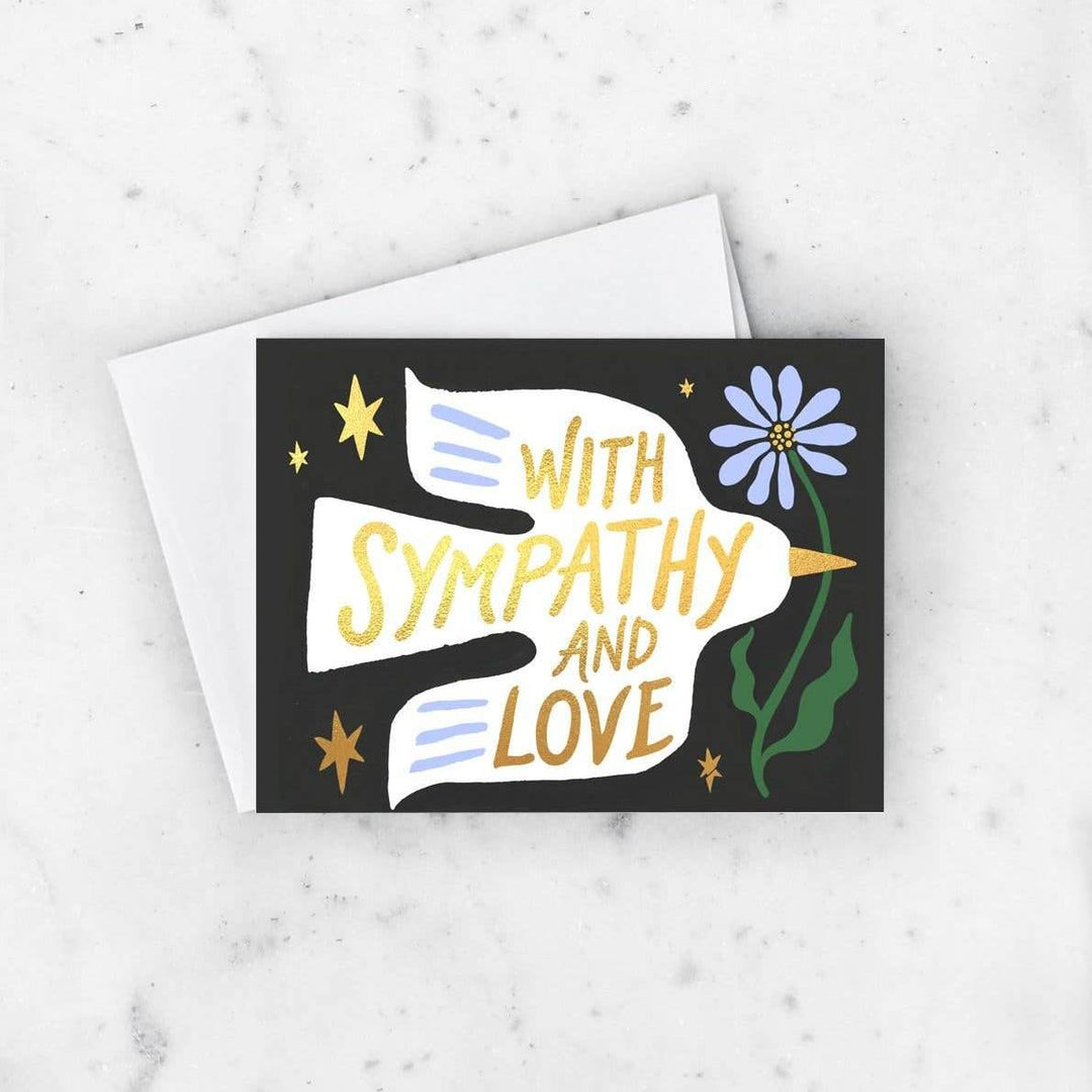 Idlewild Co. | Sympathy Dove Card | A black card with a white dove and text that reads "With sympathy and love".