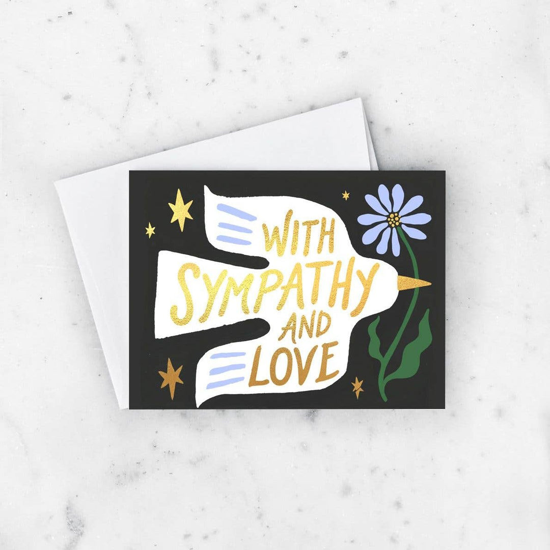 Idlewild Co. | Sympathy Dove Card | A black card with a white dove and text that reads "With sympathy and love".