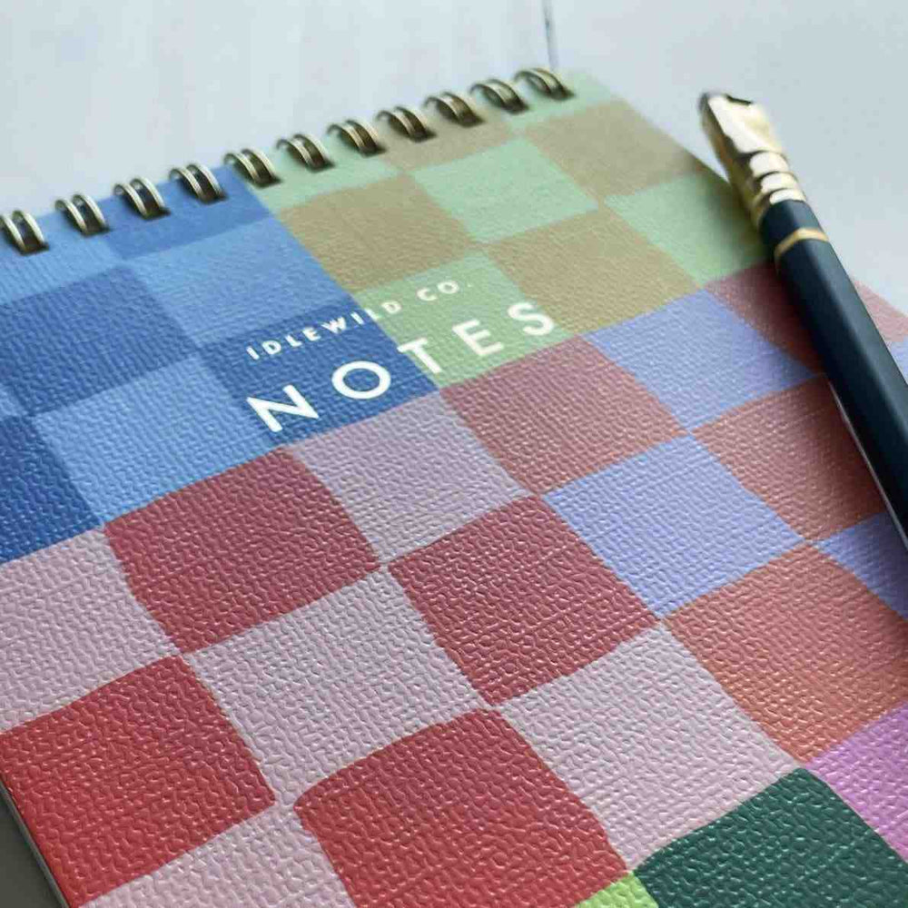 Idlewild Co. | Checkered Notepad | A colorful checkered note pad. title is in gold and reads "Idlewild Co. NOTES".