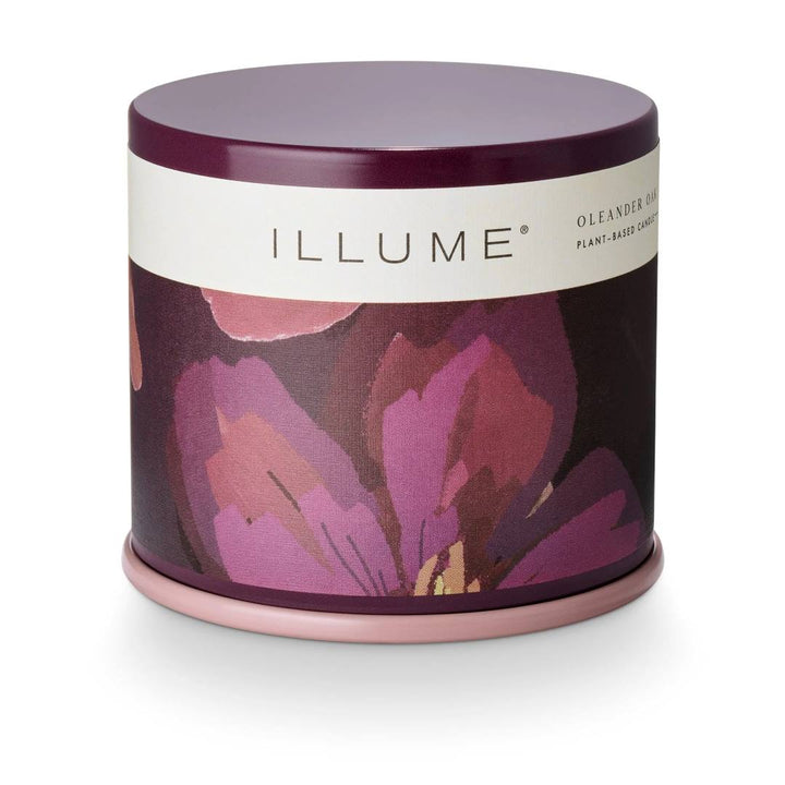 Illume | Vanity Tin, oleander oak scented. Purple candle exterior.