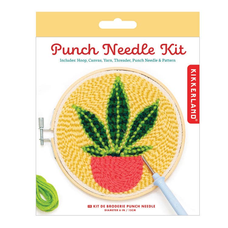 Kikkerland Punch Needle Kit packaging with a plant design on yellow fabric.