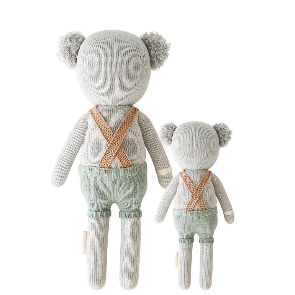 Quinn The Koala | Cuddle + Kind | Plush Toy | Photo showing the reverse side of the koala. The suspenders are crisscrossed in the back. 
