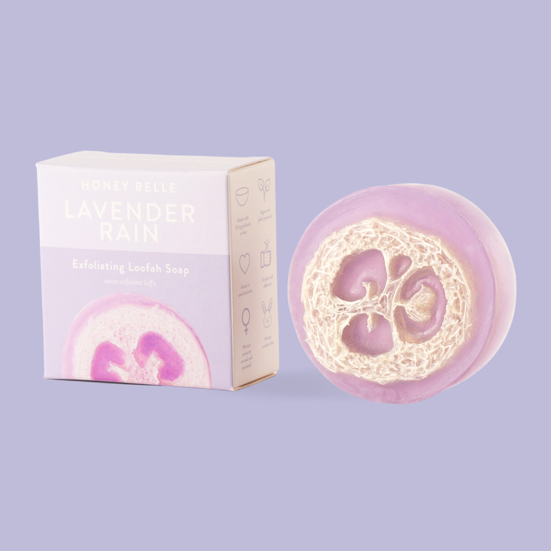 Lavender soap bar with packaging on a light purple background