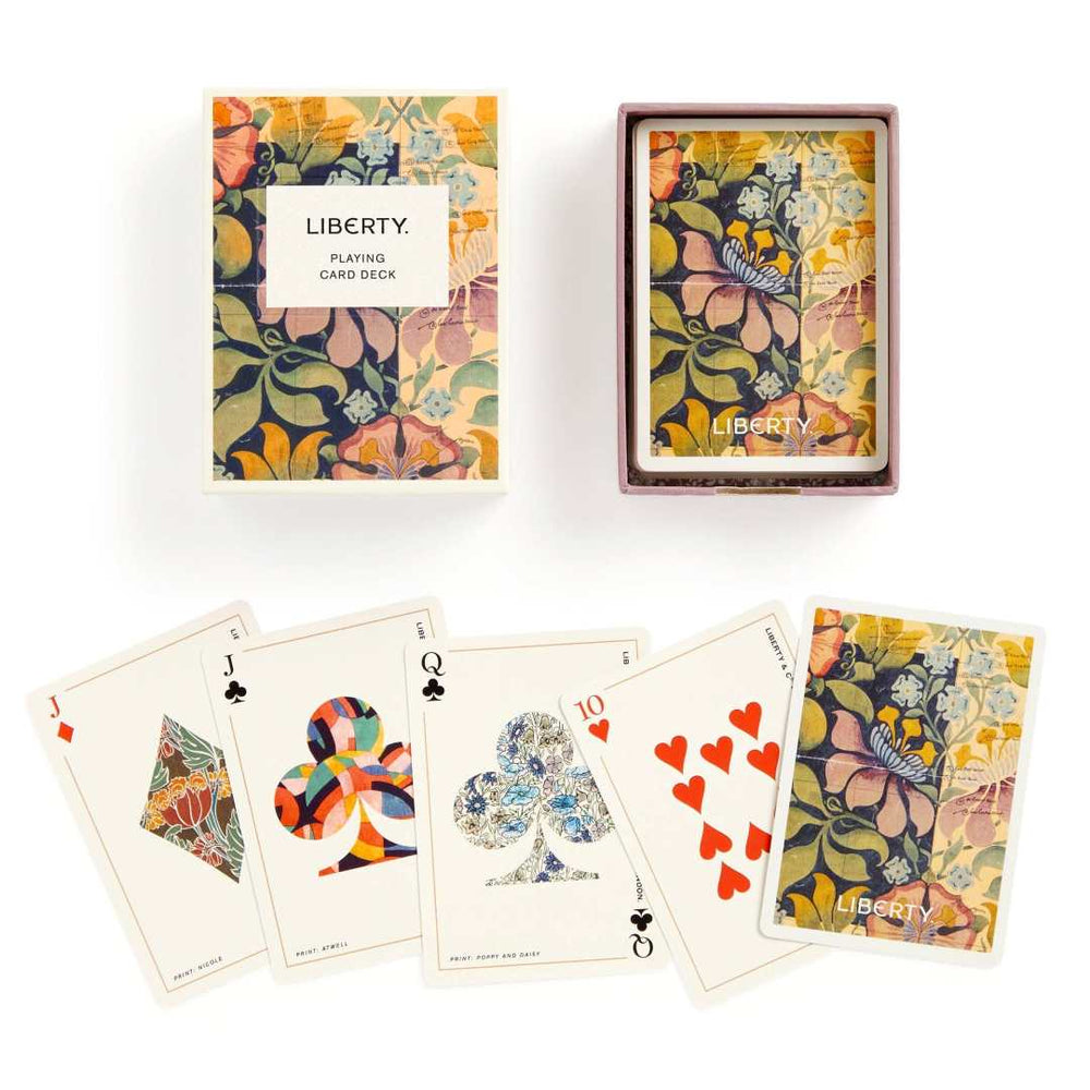 Liberty playing card deck with floral design and cards displayed on a white background