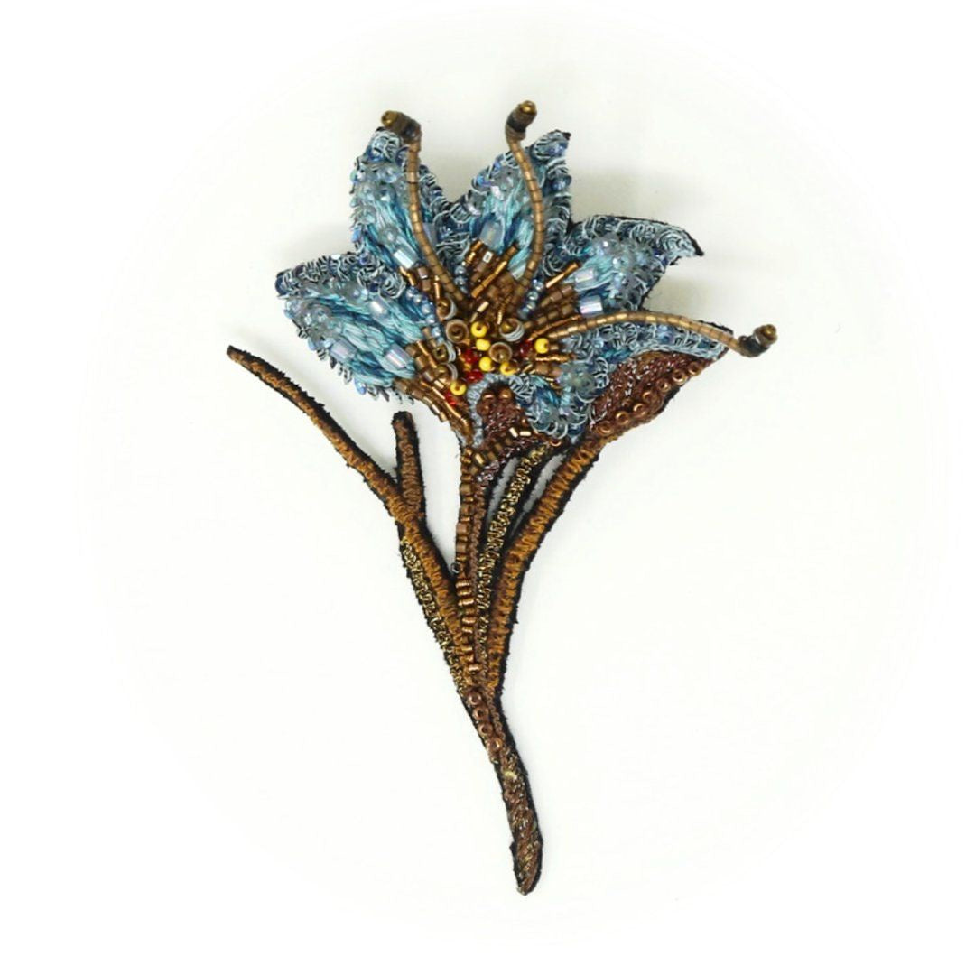 Blue Saffron Flower | Trovelore | A blue and gold colored saffron flower, hand embroidered with beading.