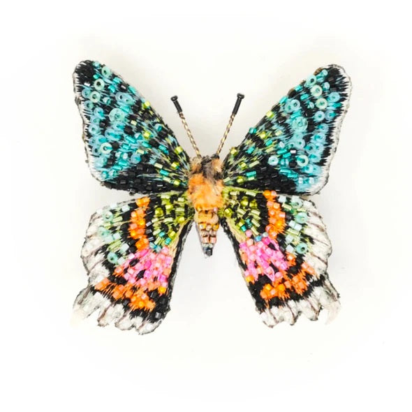 Trovelore | Madagascar Sunset Moth Brooch | A colorful moth made with beads and embroidery.