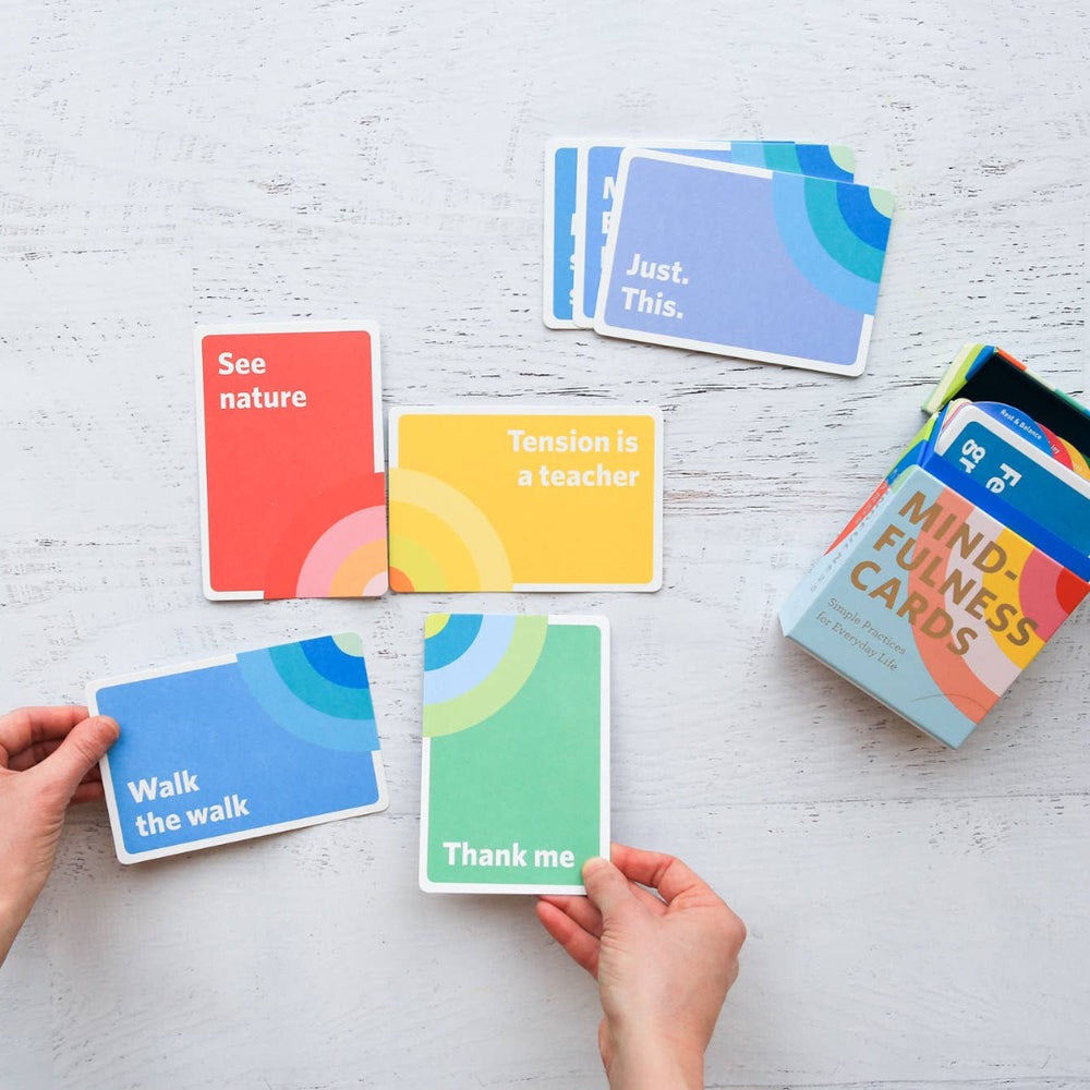 Colorful cards with motivational phrases on a light gray surface