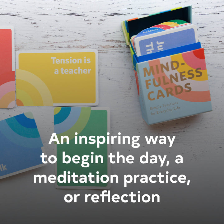 Mindfulness cards with a box on a wooden surface, featuring text about meditation and reflection.