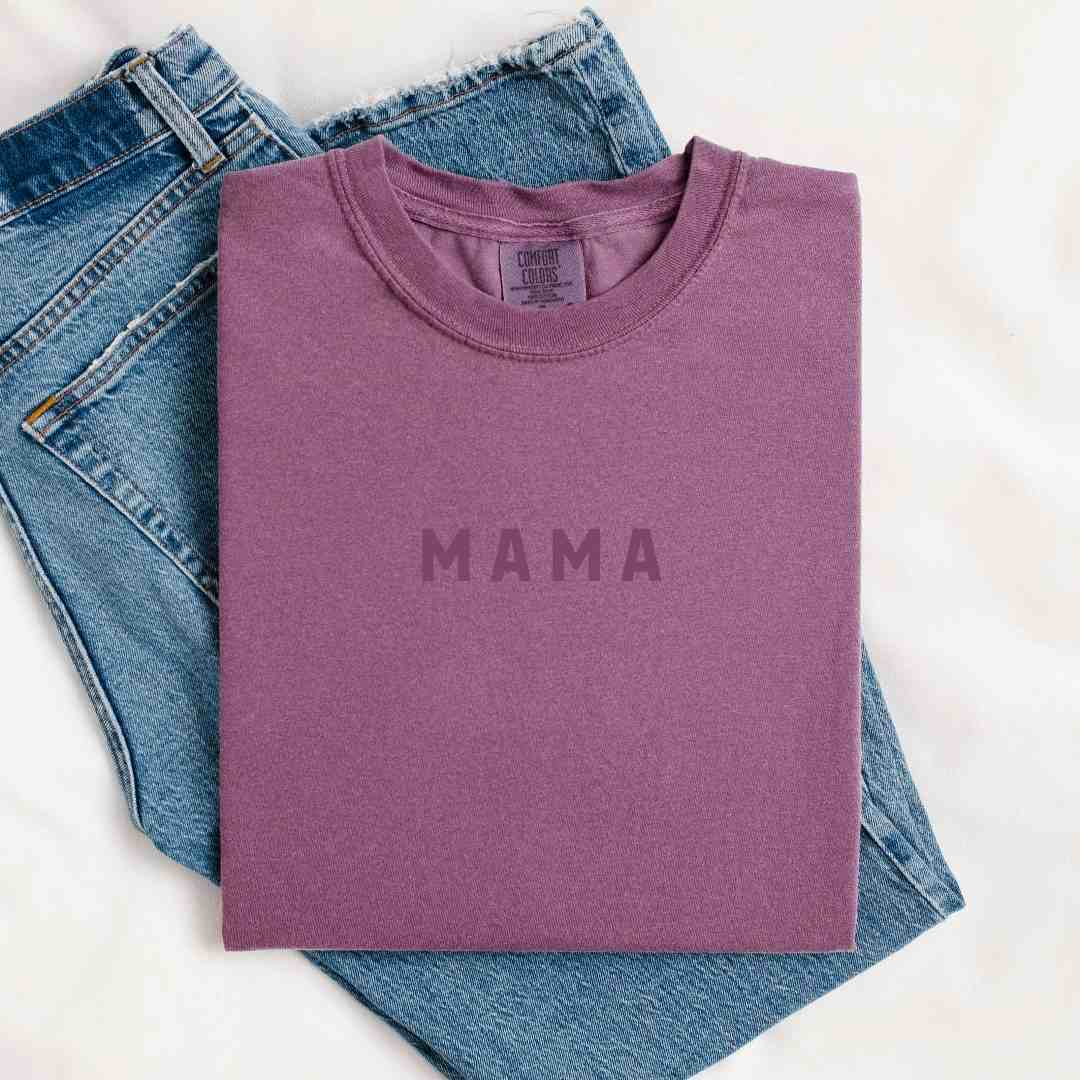 Mugsby | Mama Shirt | A purple shirt with dark purple text that reads Mama.