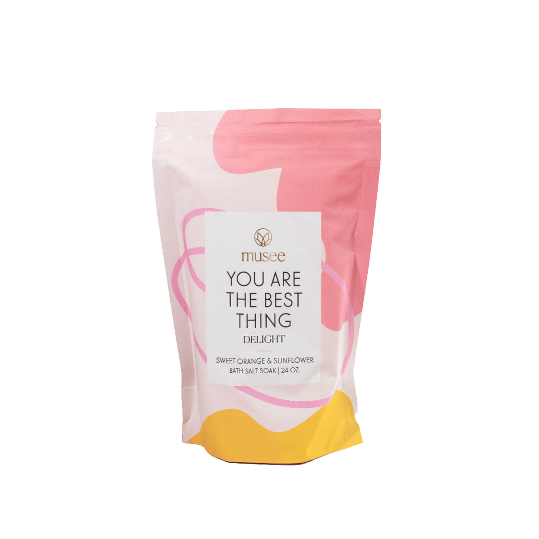 Musee chocolate packaging with pink and yellow design on a white background