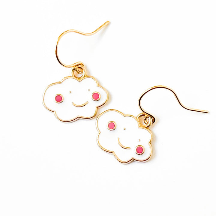 Nest Pretty Things | Cloud-shaped earrings with gold frames and pink accents on a white background