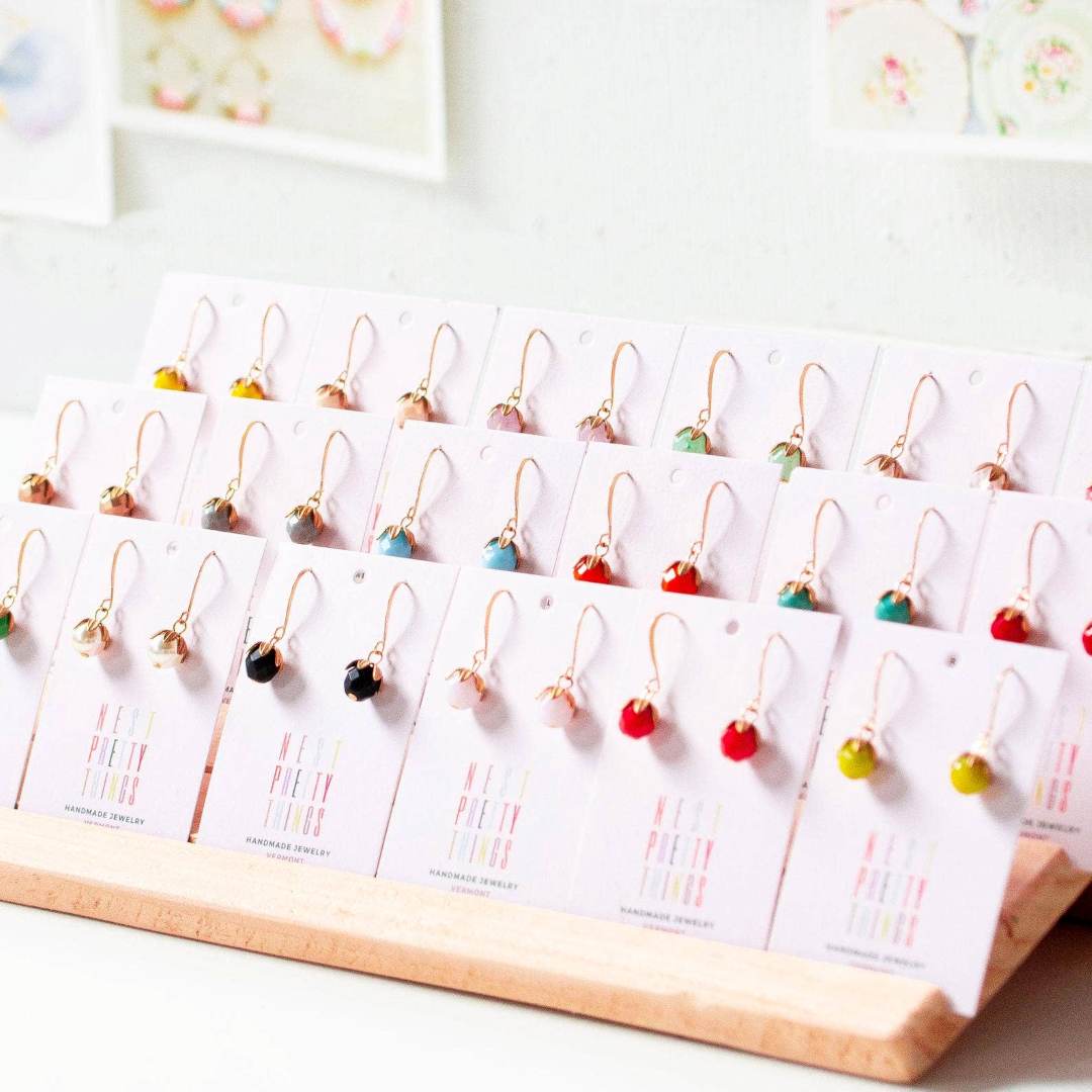 Nest Pretty Things | Assorted earrings on display cards with a white background
