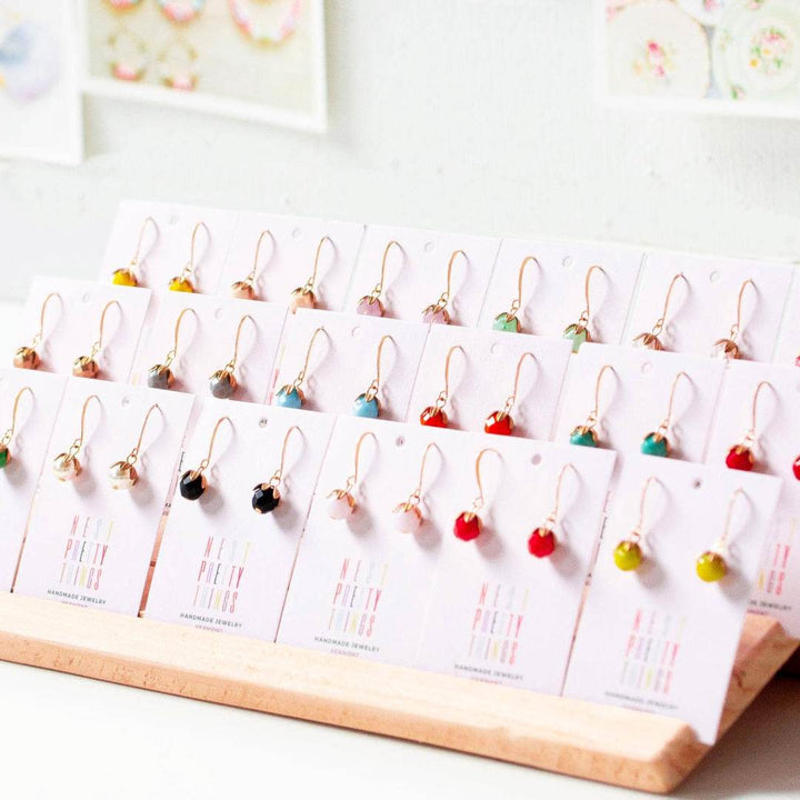 Nest Pretty Things | Assorted earrings on display cards with a white background