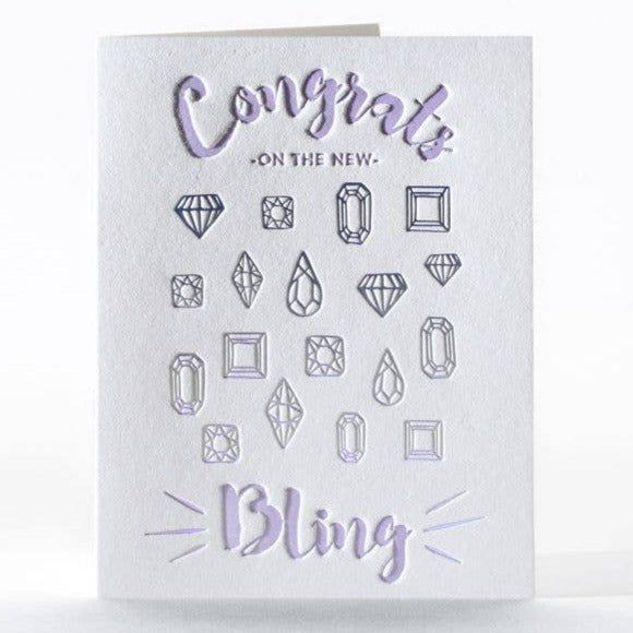 New Bling | Elum Designs | A white card with purple text and different shaped diamonds. Text reads "Congrats On The New Bling".