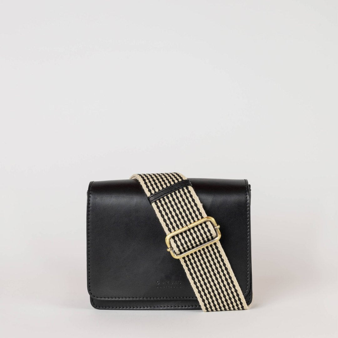 O My Bag | Audrey Mini | Black leather with a black and white striped strap.