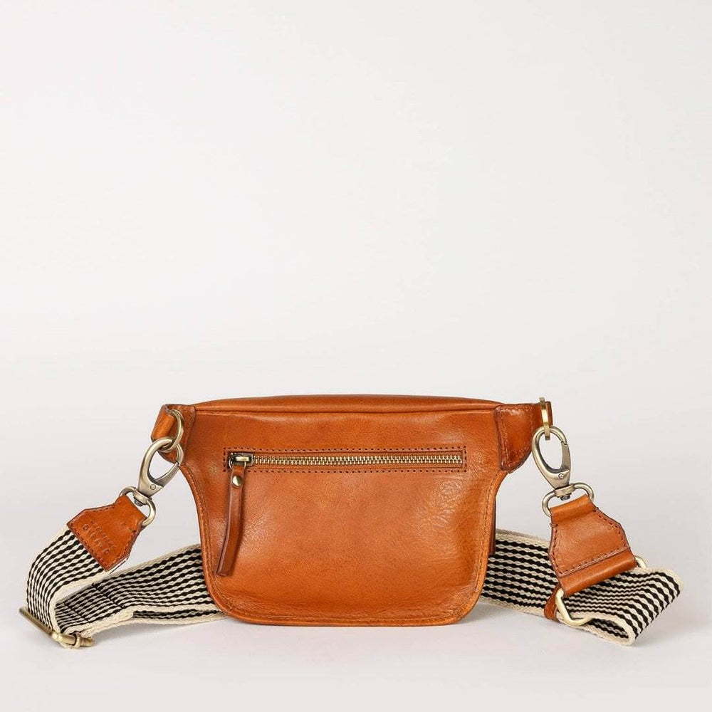 O My Bag | Beck's Bum Bag | Cognac Stromboli Leather with a black and white striped strap.