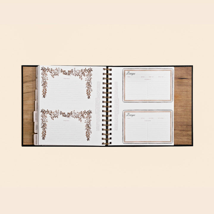 Open planner with floral design on a beige background