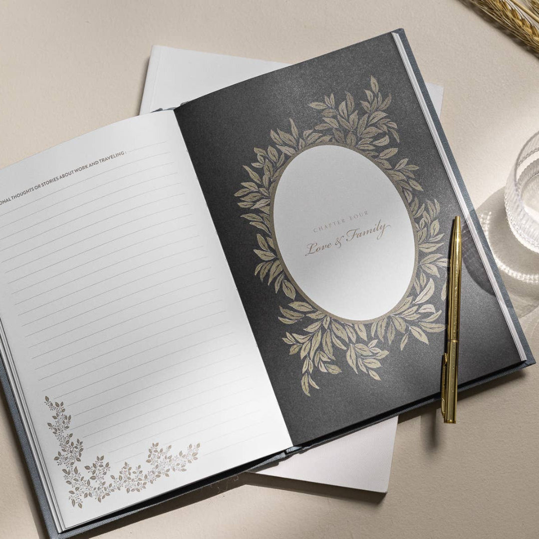 Open notebook with decorative cover and pen on a light surface