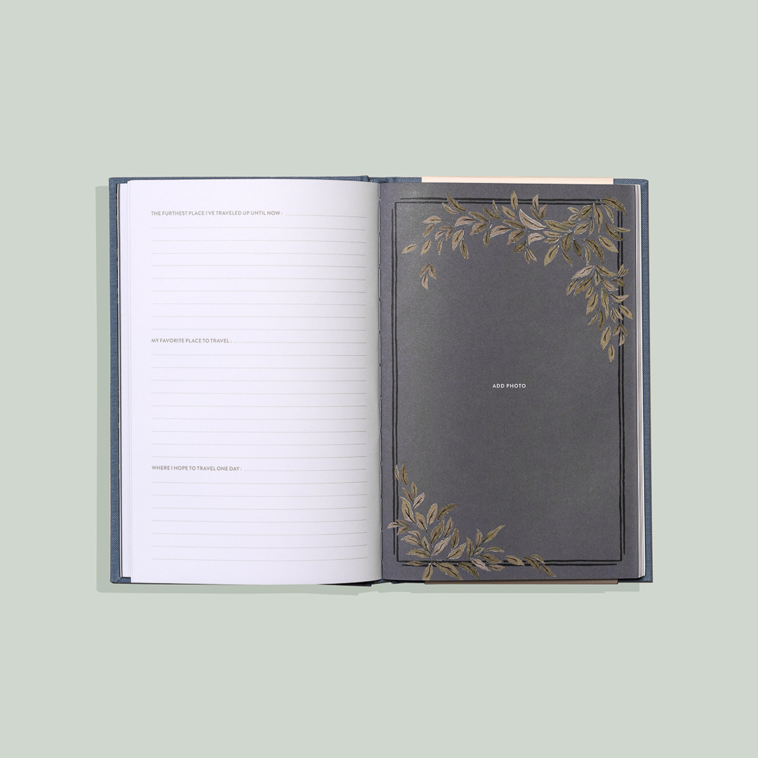 Open notebook with decorative cover on a light green background