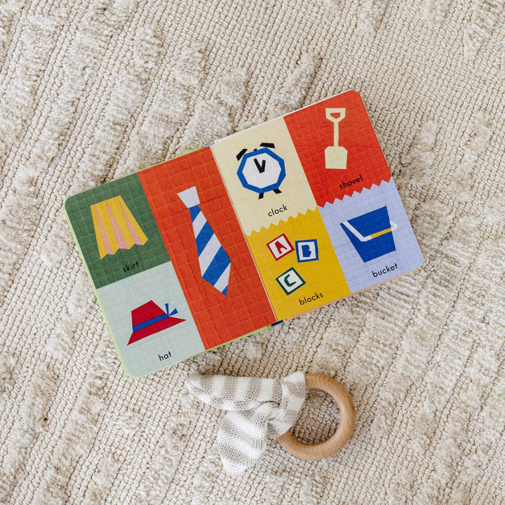 Colorful children's card with illustrations of objects on a textured beige surface