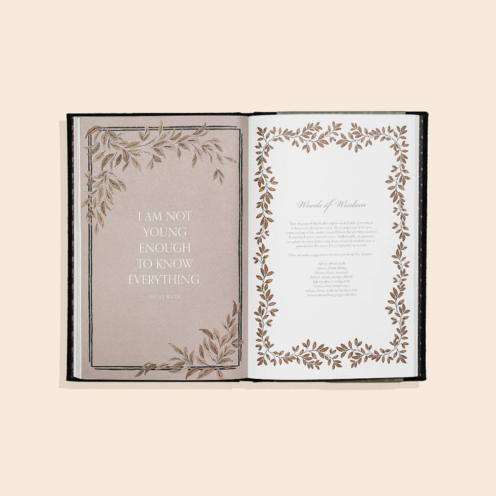 Open book with decorative pages and a quote on a beige background