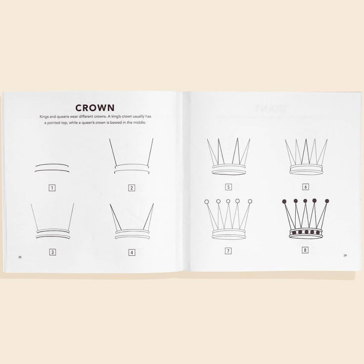 Open book showing illustrations of a crown design on a beige background