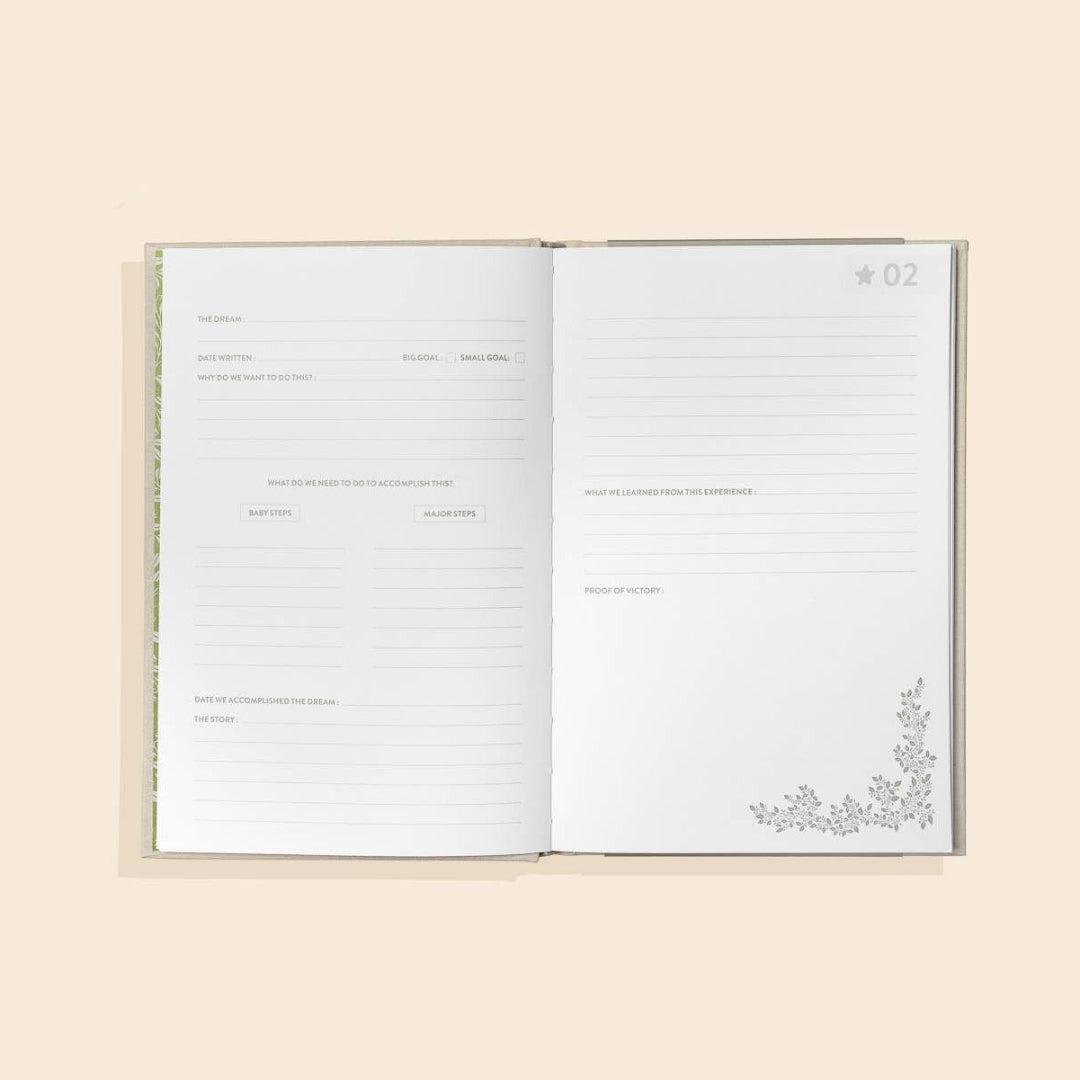 Open notebook with lined pages on a beige background