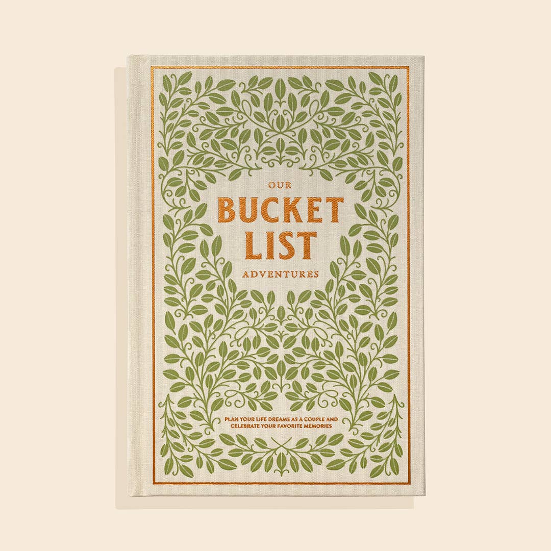 Book titled 'Our Bucket List Adventures' with green leafy design on a beige background