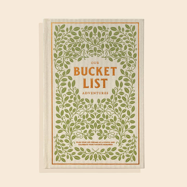 Book titled 'Our Bucket List Adventures' with green leafy design on a beige background