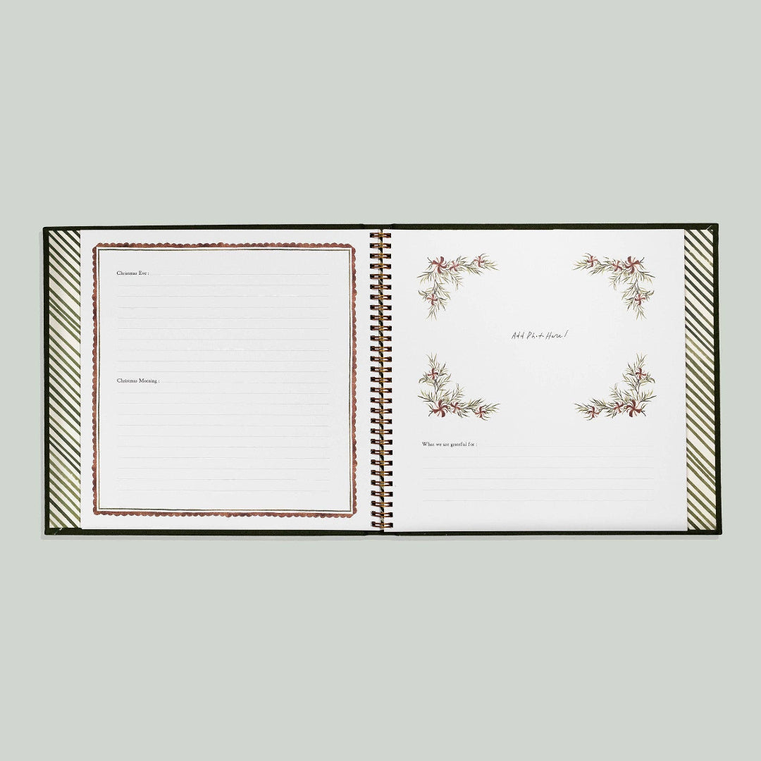 Open notebook with decorative pages on a light gray background