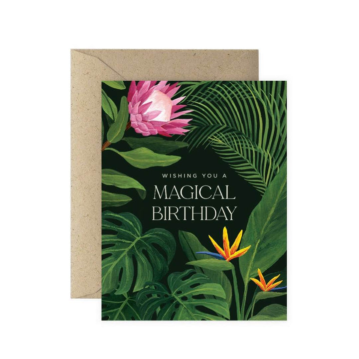 Paper Anchor Co. | Magical Birthday Tropical Floral Greeting Card | A plant covered card with a protea flower and birds of paradise. Text reads "Wishing you a magical birthday".