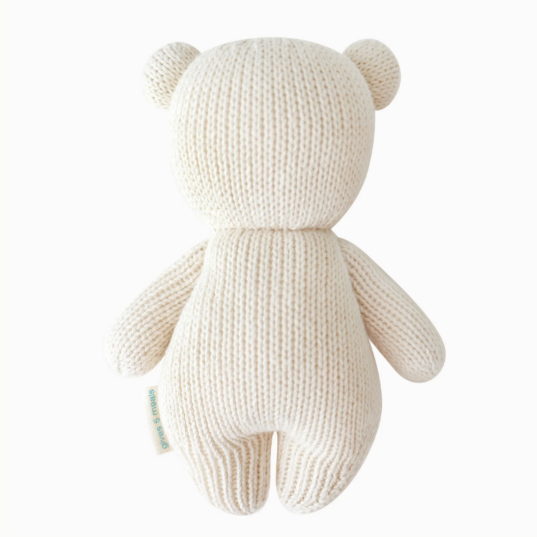 Baby Polar Bear | Cuddle + Kind | Reverse side of the white polar bear plush. Hand knit.