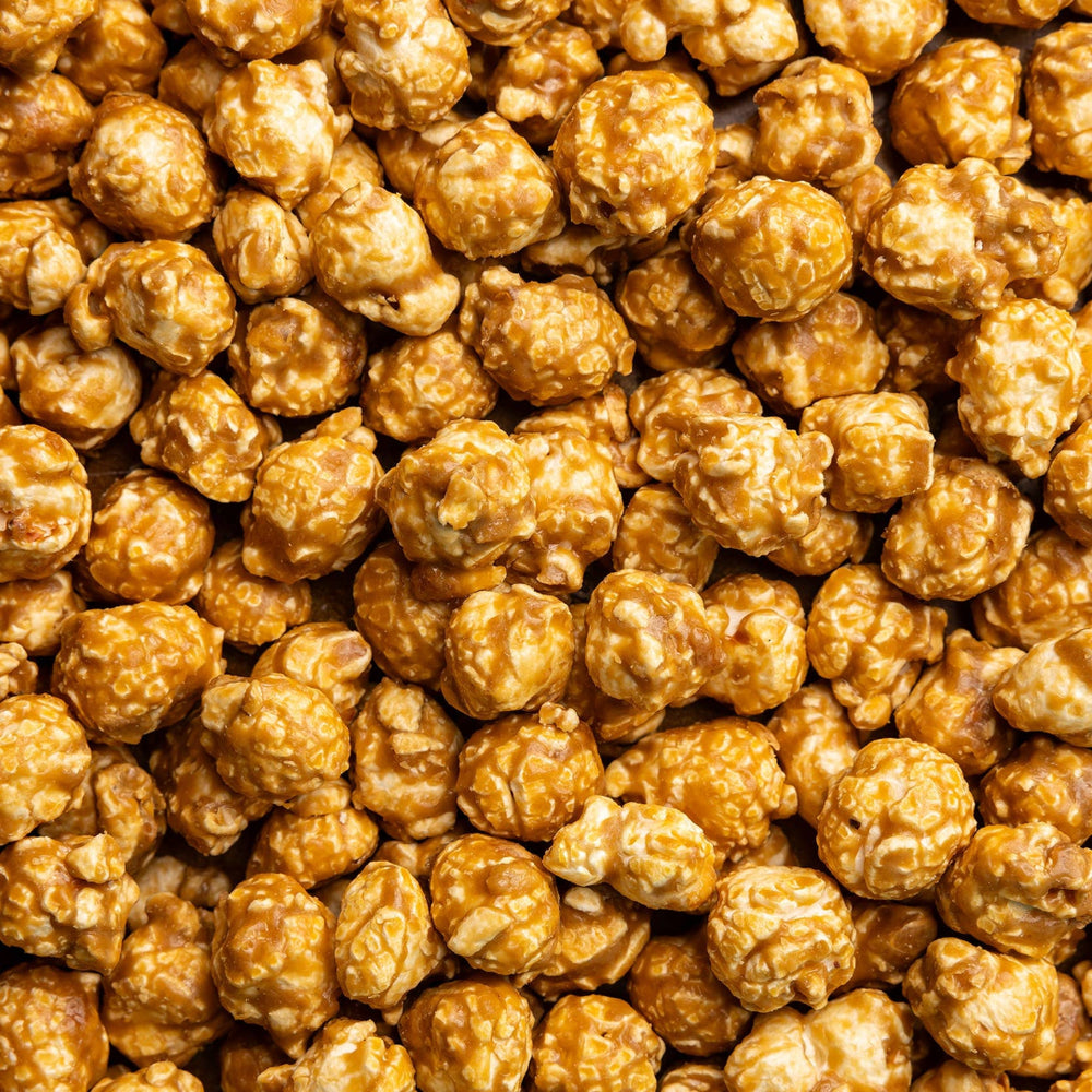 Close-up of salted caramel popcorn with a brown background