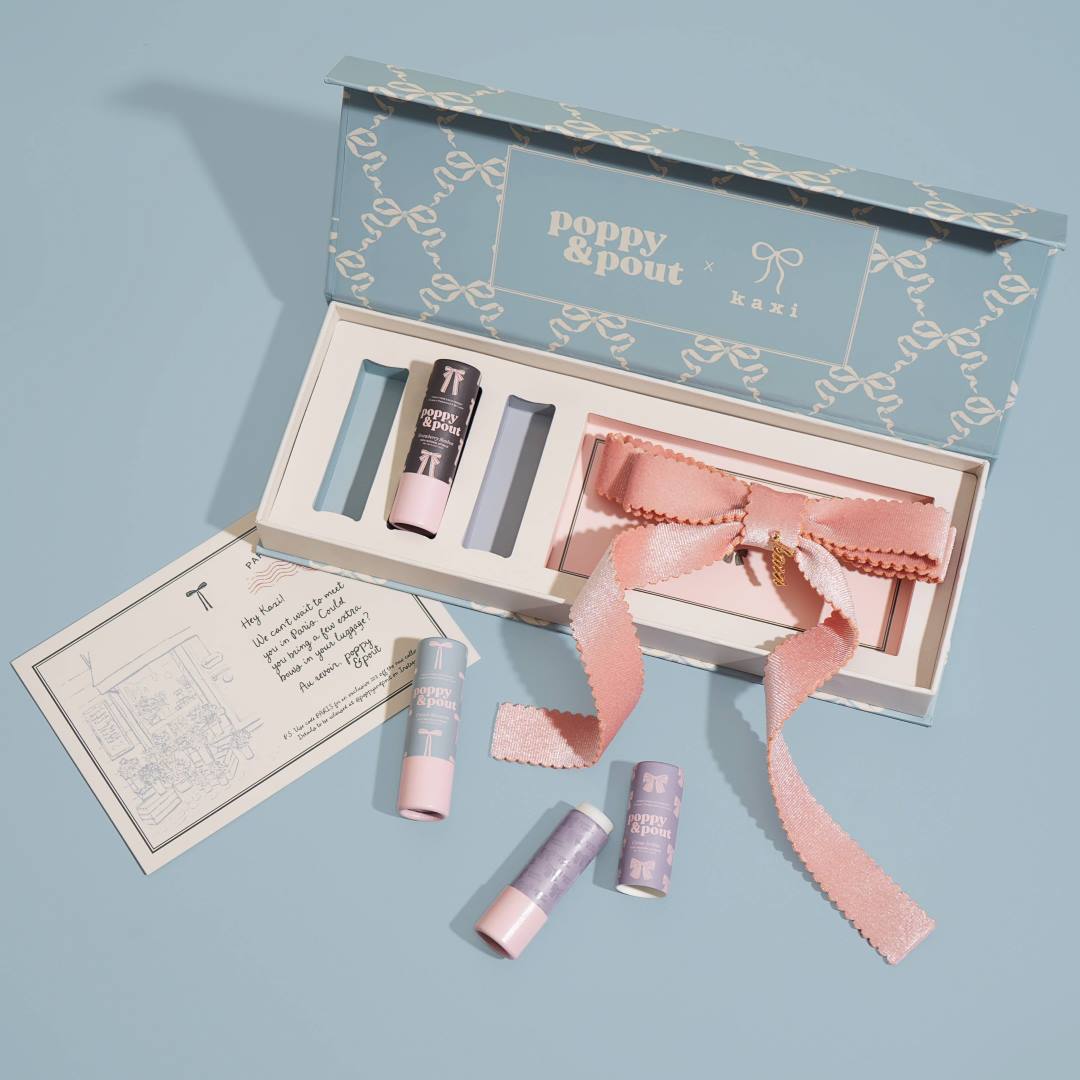 Poppy & Pout | Kaxi | Collaboration | three poppy and pout lip balms in a gift set with a custom pink hair bow.