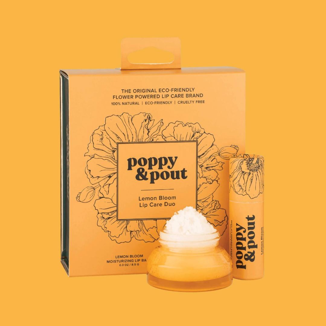 Poppy & Pout | Lip Care Duo, Lemon Bloom | A yellow box with a glass container of lip scrub and a lip balm. Box reads: The original eco-friendly flower powered lip care brand. 100% natural, eco-friendly - cruelty free.