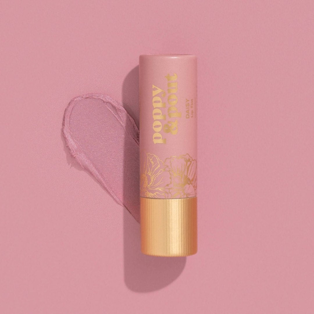 Poppy & Pout | Lip Tint, Daisy | A light pink lip tint balm with gold accents.