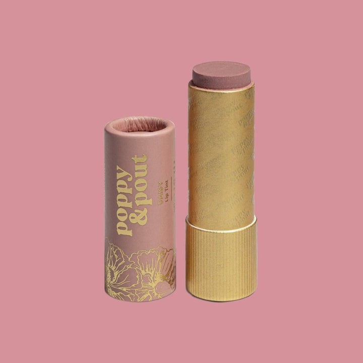 Poppy & Pout | Lip Tint, Daisy | Opened balm showing the gold sleeve and natural pink balm color.