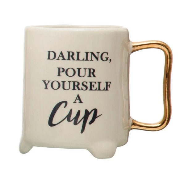 A set of four white ceramic teacups with gold electroplating, each with a different witty saying printed on the side.